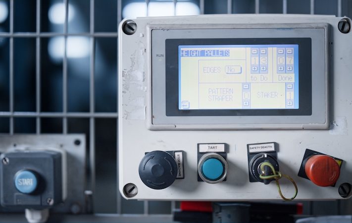Close up view of a control panel for an industrial machine.